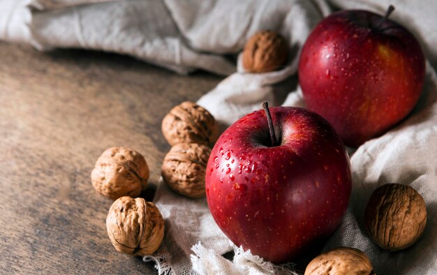 High angle of autumn apples with walnuts