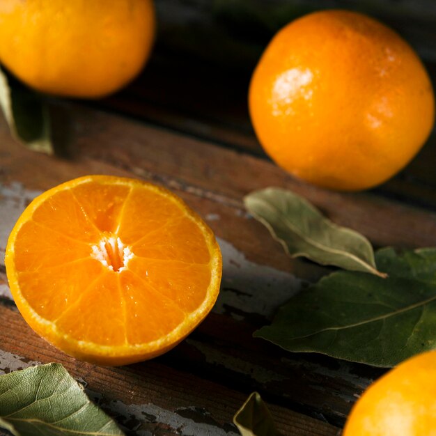 High angle of autumn oranges with leaves