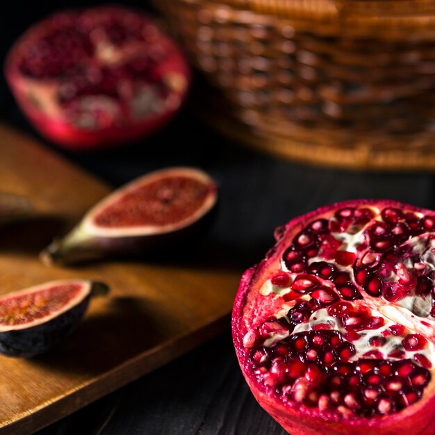 High angle of autumn pomegranates and figs