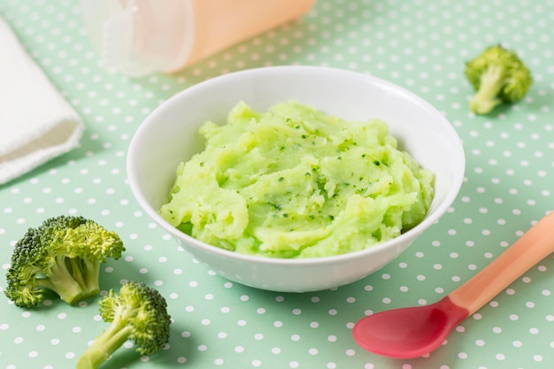 High angle baby food with broccoli