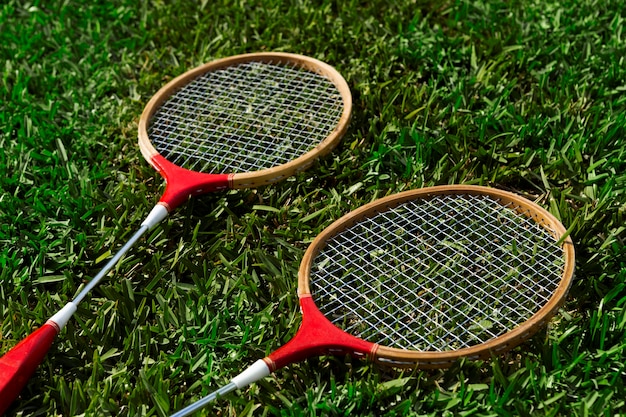 Free photo high angle badminton rackets still life