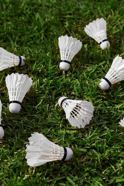 High angle badminton shuttlecocks on grass