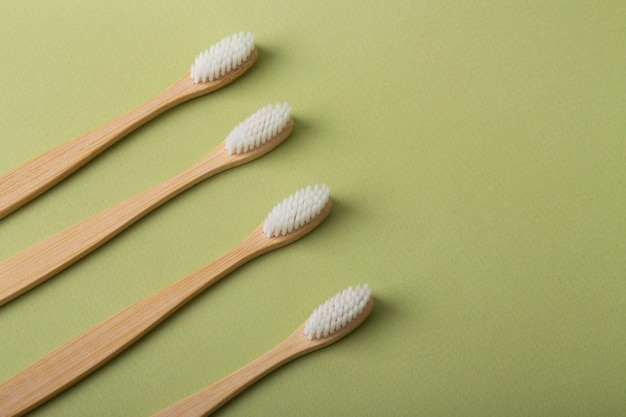 High angle bambu brushes on green background