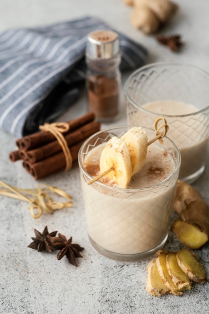 High angle banana smoothie and cinnamon rolls