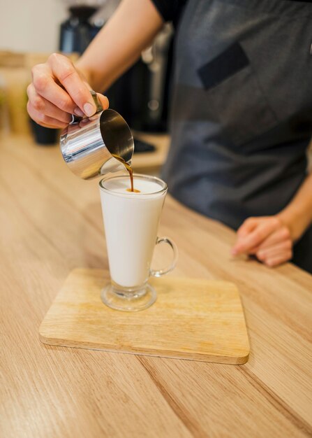 High angle of barista making coffee beverage