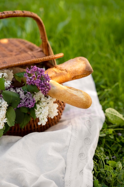 High angle basket with flowers and baguettes