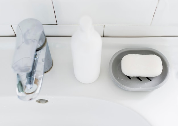 Free photo high angle of bathroom sink with soap