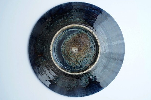 High angle of a beautiful vintage ceramic bowl on grey