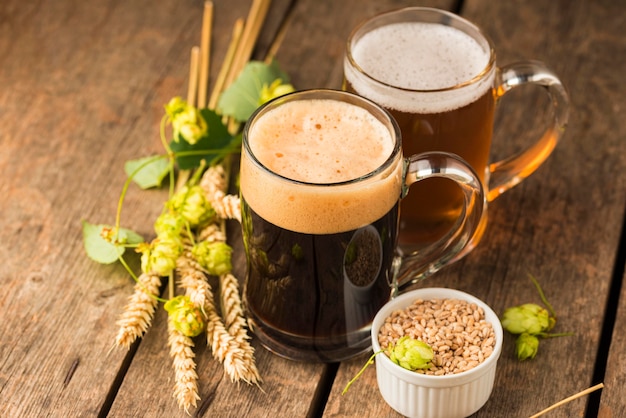 High angle beer mugs and wheat