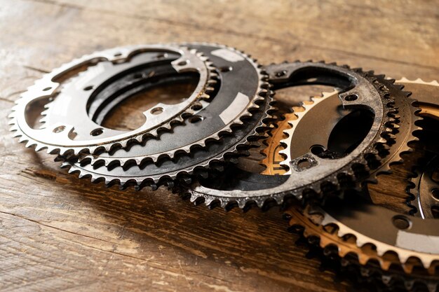 High angle bicycle pieces on wooden table