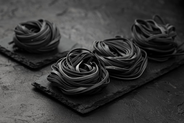 High angle of black pasta bundles