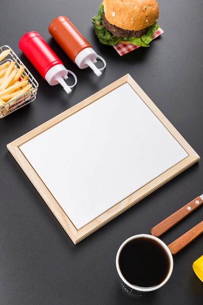 High angle of blank menu paper with burger and french fries