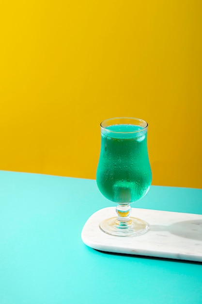 High angle blue beverage in glass