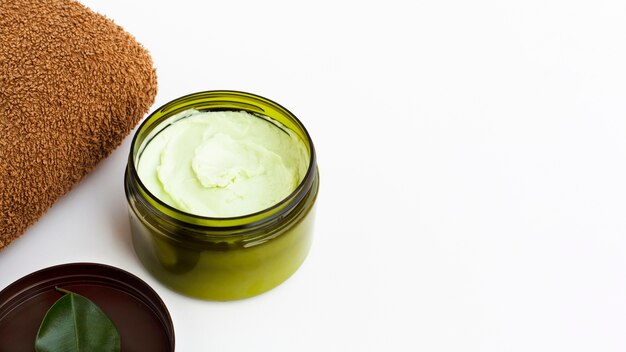 High angle of body butter on white background with copy space