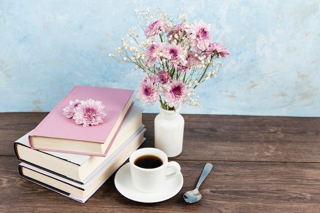 High angle of book arrangement on wooden table