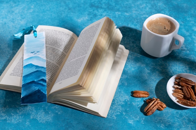 Free photo high angle book and coffee cup arrangement