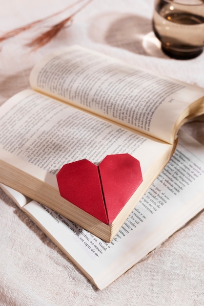 Free photo high angle books and heart bookmark