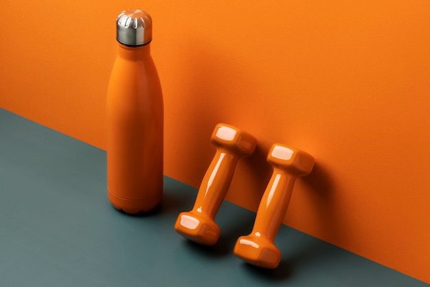 High angle bottle and dumbbells