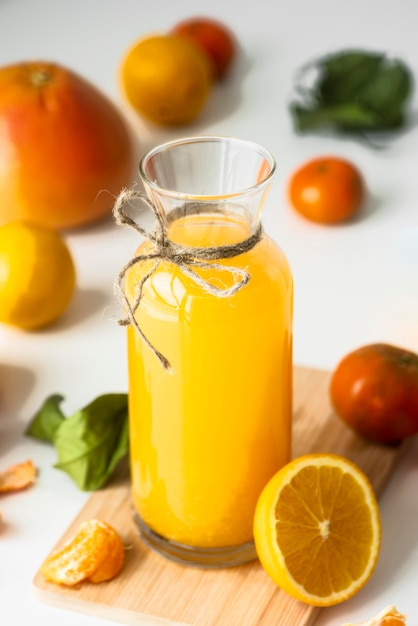 High angle bottle with orange juice