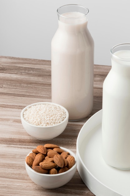 Free photo high angle of bottles of different types of milk