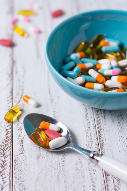 High angle bowl and spoon with pills