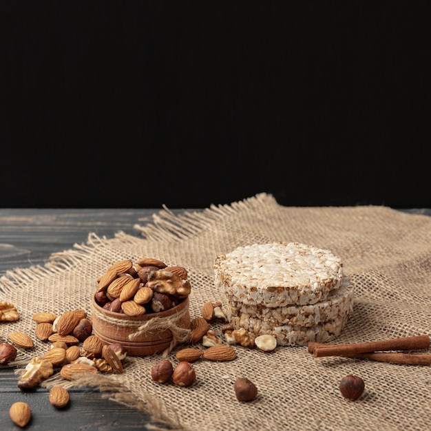 High angle of bowl with almonds and other nuts with copy space