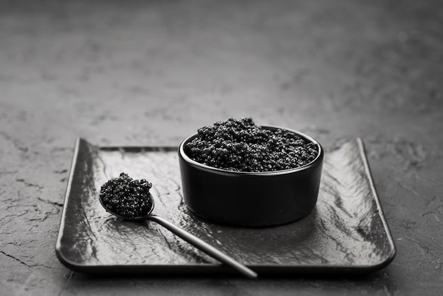 High angle of bowl with black caviar
