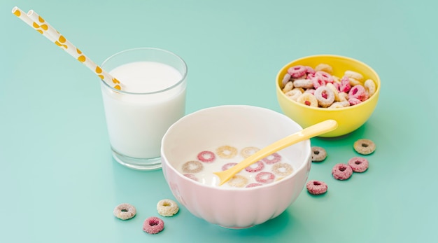 High angle bowl with cereals and milk on table