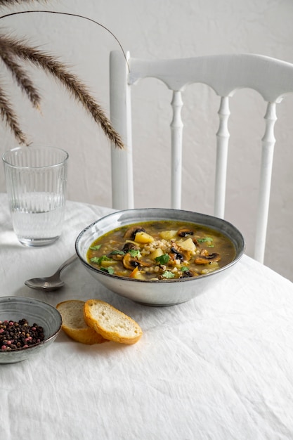 High angle bowl with food and bread on table