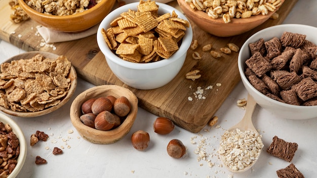 High angle of bowls with selection of breakfast cereals