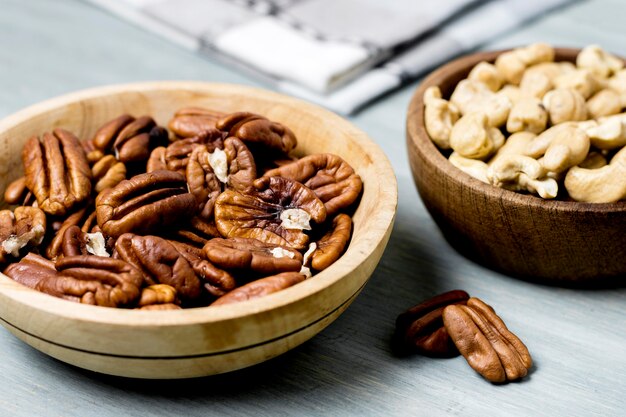 High angle of bowls with walnuts and cashews