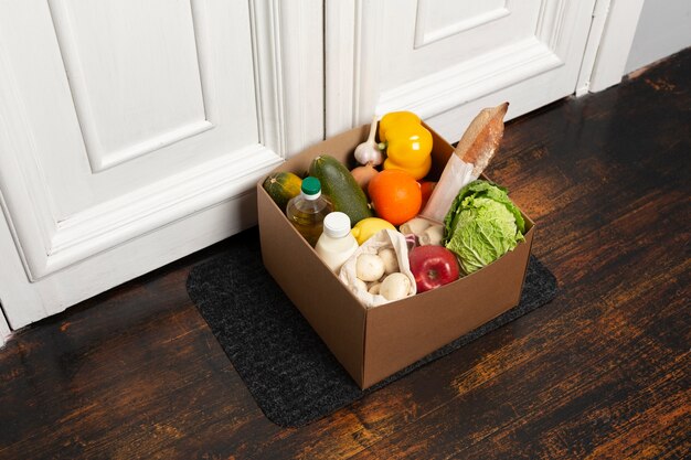 High angle box with vegetables on mat