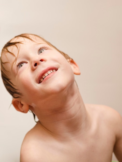 Free photo high angle boy having bath