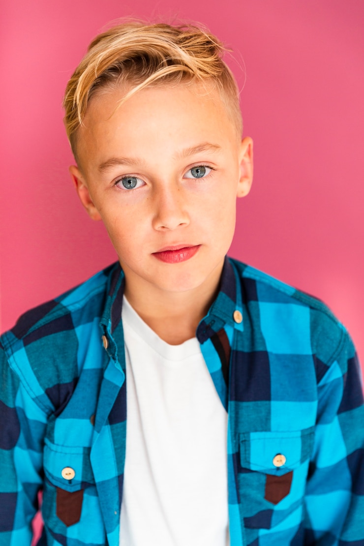 Free Photo high angle boy in studio posing
