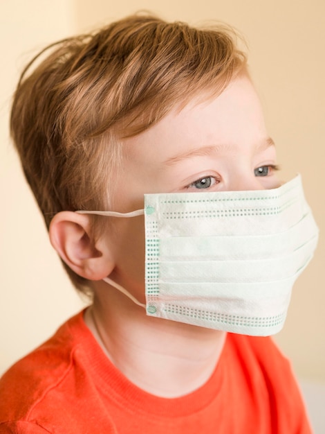 High angle boy wearing mask