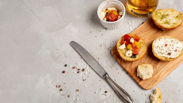 High angle of bread on chopper on plain background