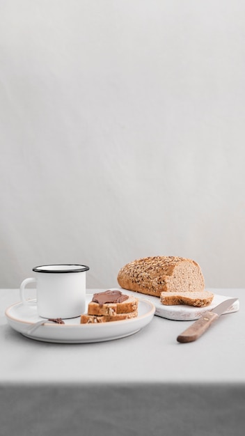 High angle bread and mug