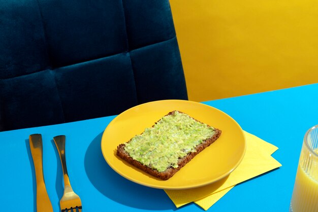 High angle bread slice with guacamole