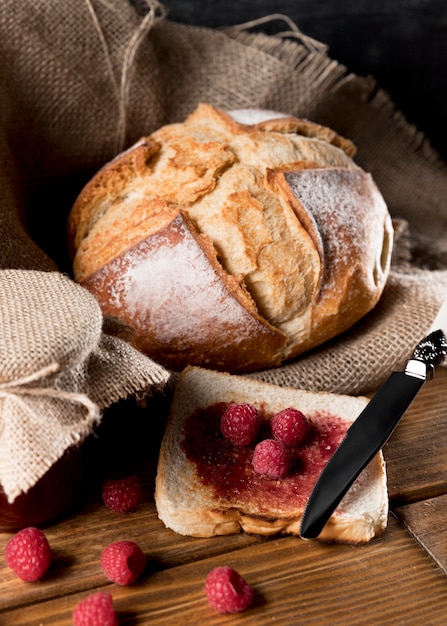 High angle of bread with raspberry jam