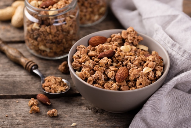 High angle of breakfast cereal in bowl with nuts