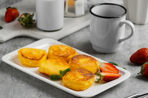 High angle breakfast on plate with strawberry