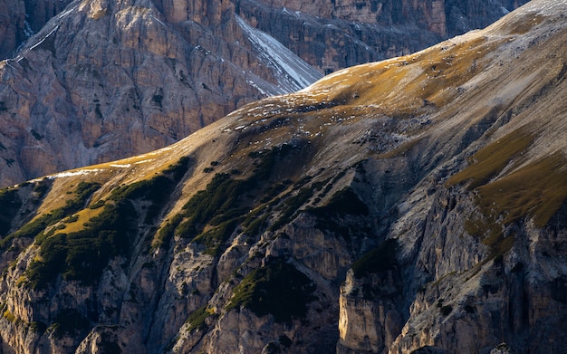 Free photo high angle breathtaking shot of a landscape in the italian alps