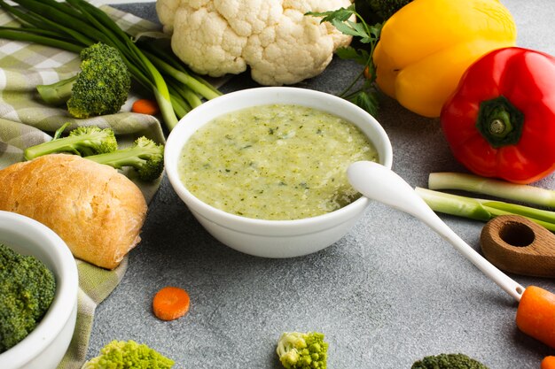 High angle broccoli bisque with vegetables mix