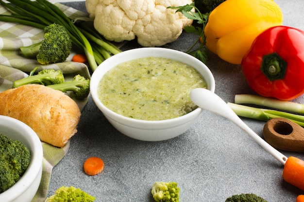 High angle broccoli bisque with vegetables mix