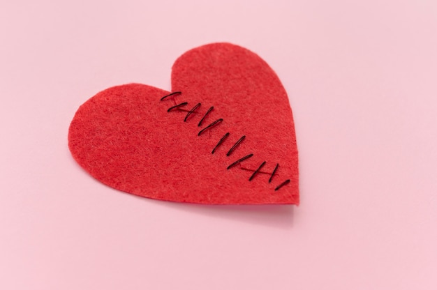 Free photo high angle of broken heart stitched back together