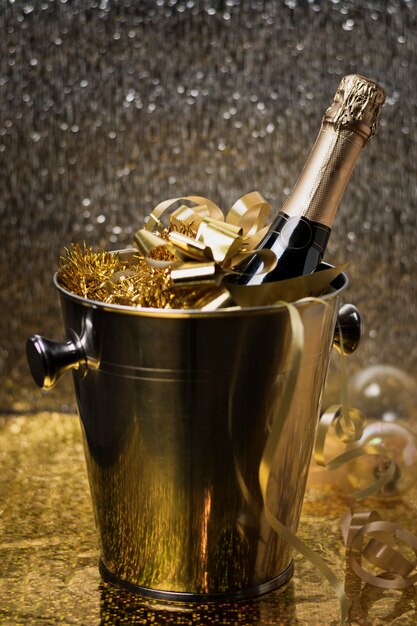 High angle bucket with champagne bottle