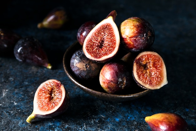 High angle of bunch of autumn figs on plate