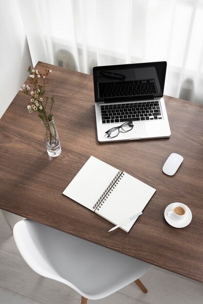 High angle business desk arrangement with laptop