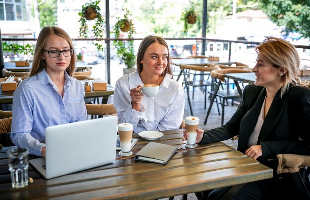 High angle business meeting with women