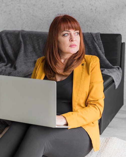 High angle business woman working on laptop